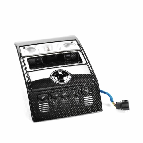 Schwarzes Carbon-Finish Automobilsteuergerät mit Bedienknöpfen und Kabelanschluss.